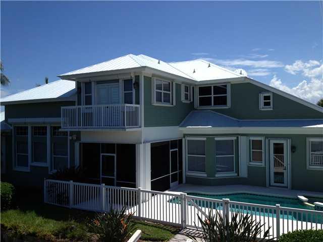 4259 Rigels Cove Way Jensen Beach, FL 34957 - Photo 2 of 22 a front view of a house with a yard