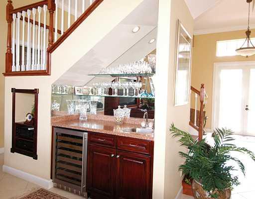 4259 Rigels Cove Way Jensen Beach, FL 34957 - Photo 21 of 22 a view of a living room and entry way