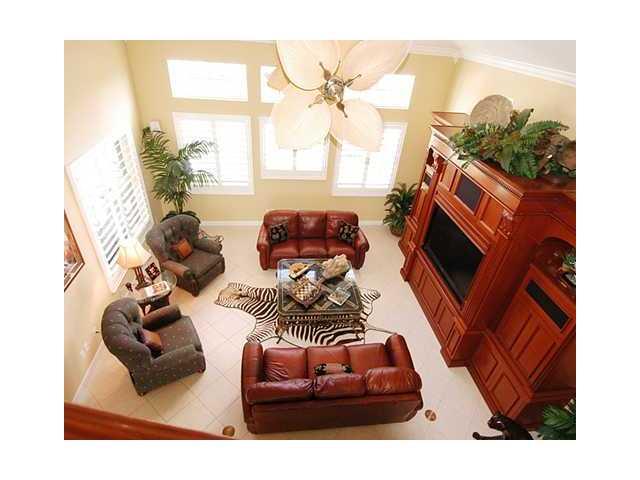 4259 Rigels Cove Way Jensen Beach, FL 34957 - Photo 6 of 22 a living room with furniture and a flat screen tv