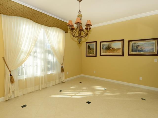 4259 Rigels Cove Way Jensen Beach, FL 34957 - Photo 7 of 22 a bathroom with a granite countertop sink a large mirror and a shower