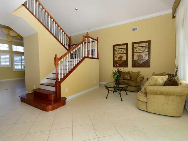 4259 Rigels Cove Way Jensen Beach, FL 34957 - Photo 10 of 22 a living room with couches and a rug