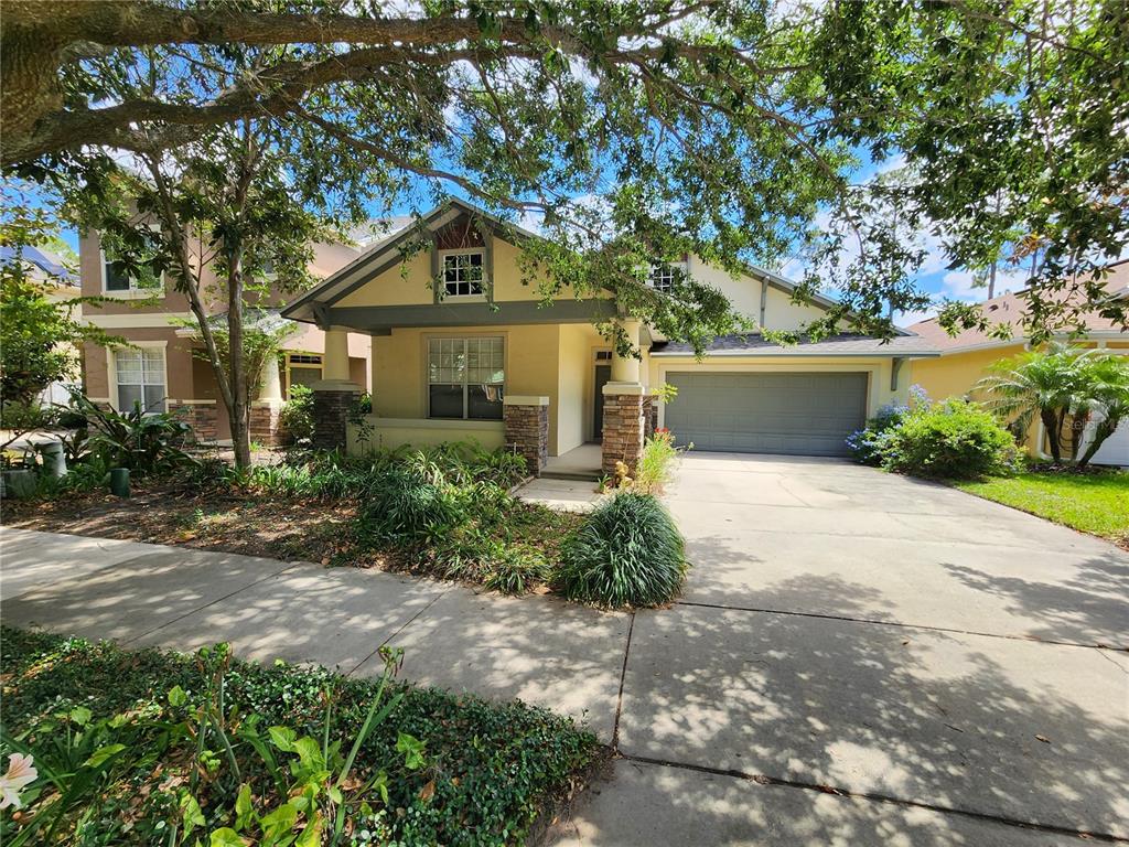 6897 Northwich Drive Windermere, FL 34786 - Photo 1 of 1 a front view of a house with a yard and trees