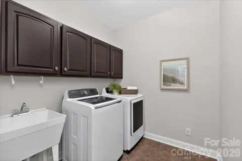 a view of a storage & utility room with a sink