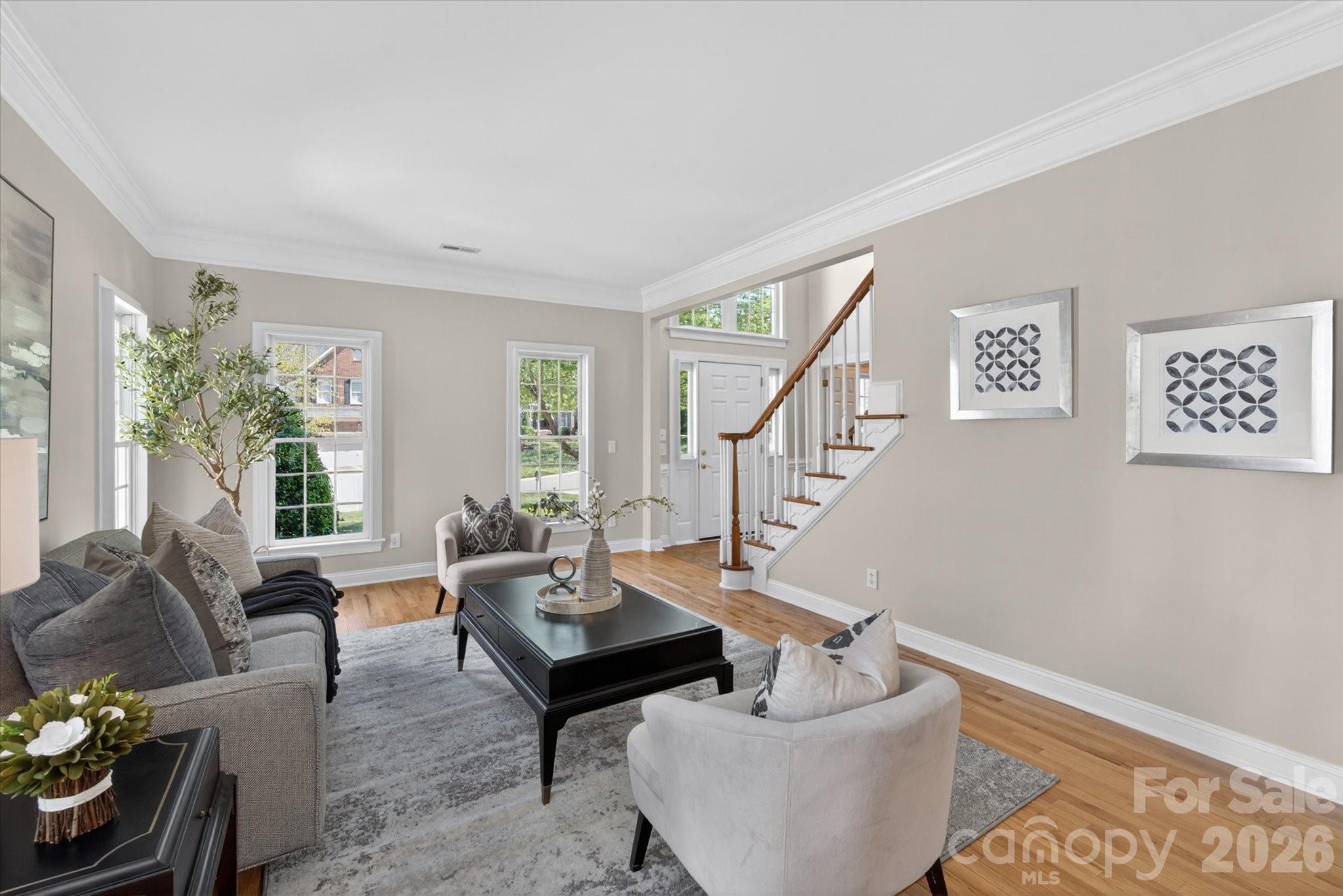 8528 Headford Road Charlotte, NC 28277 - Photo 4 of 34 a living room with furniture and a potted plant