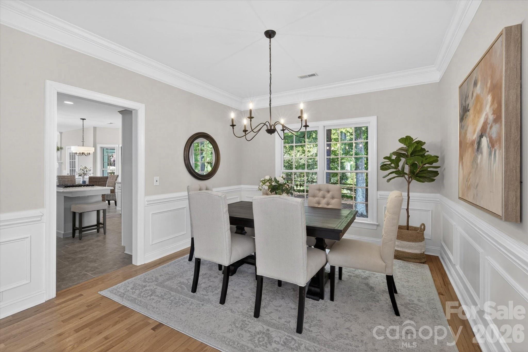 8528 Headford Road Charlotte, NC 28277 - Photo 6 of 34 a view of a dining room with furniture window and wooden floor