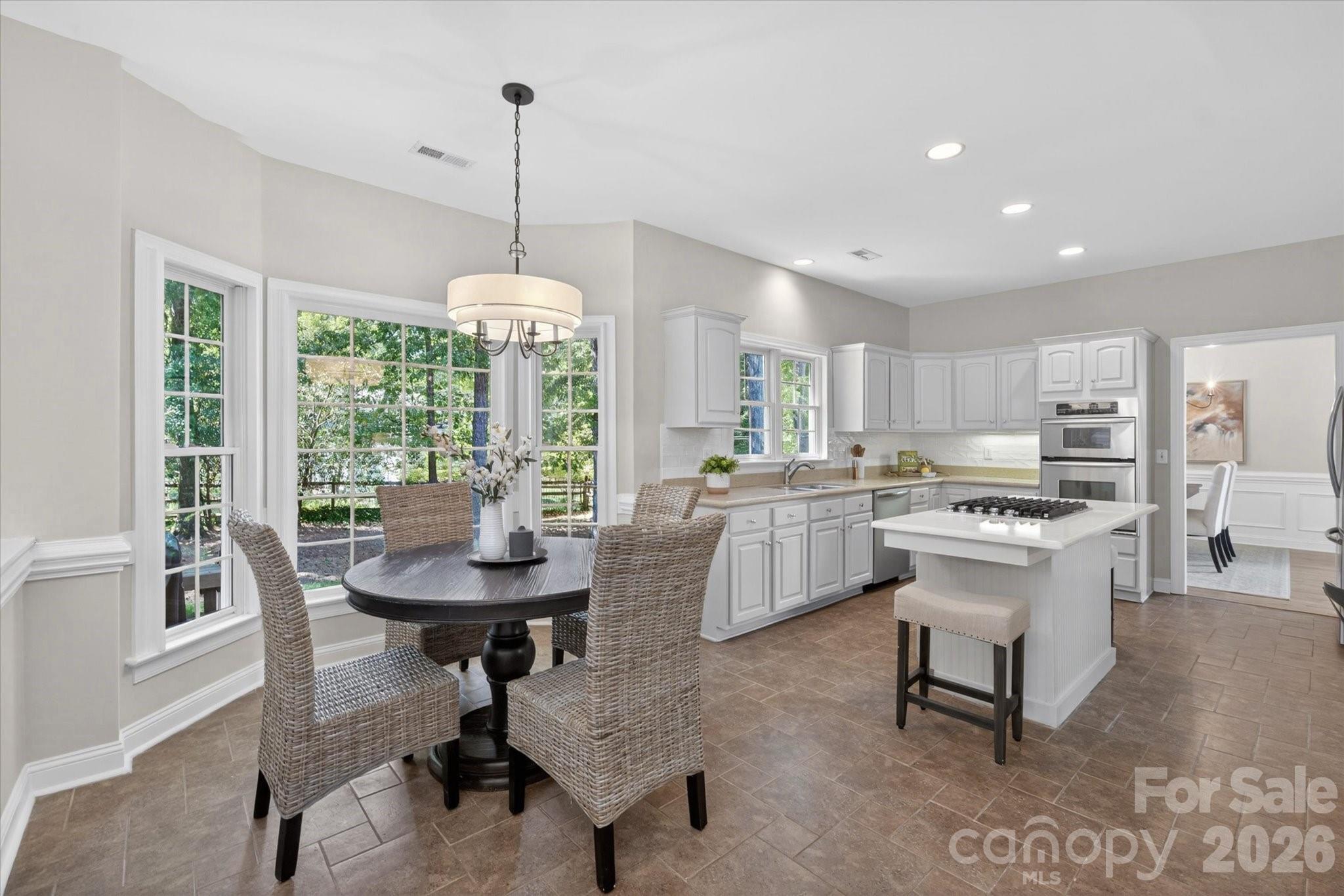 8528 Headford Road Charlotte, NC 28277 - Photo 9 of 34 a kitchen with counter space and windows