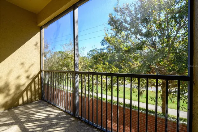 a view of a balcony with wooden floor