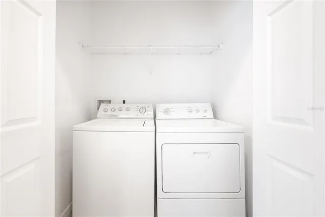 a utility room with dryer and washer
