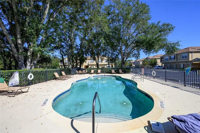 a view of a swimming pool with a patio