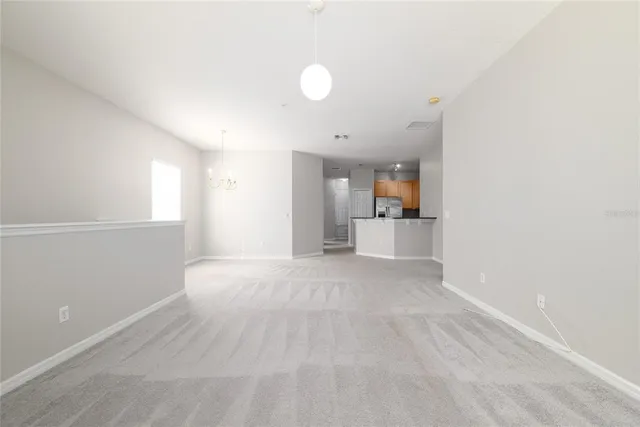 a view of a kitchen with a sink and a window