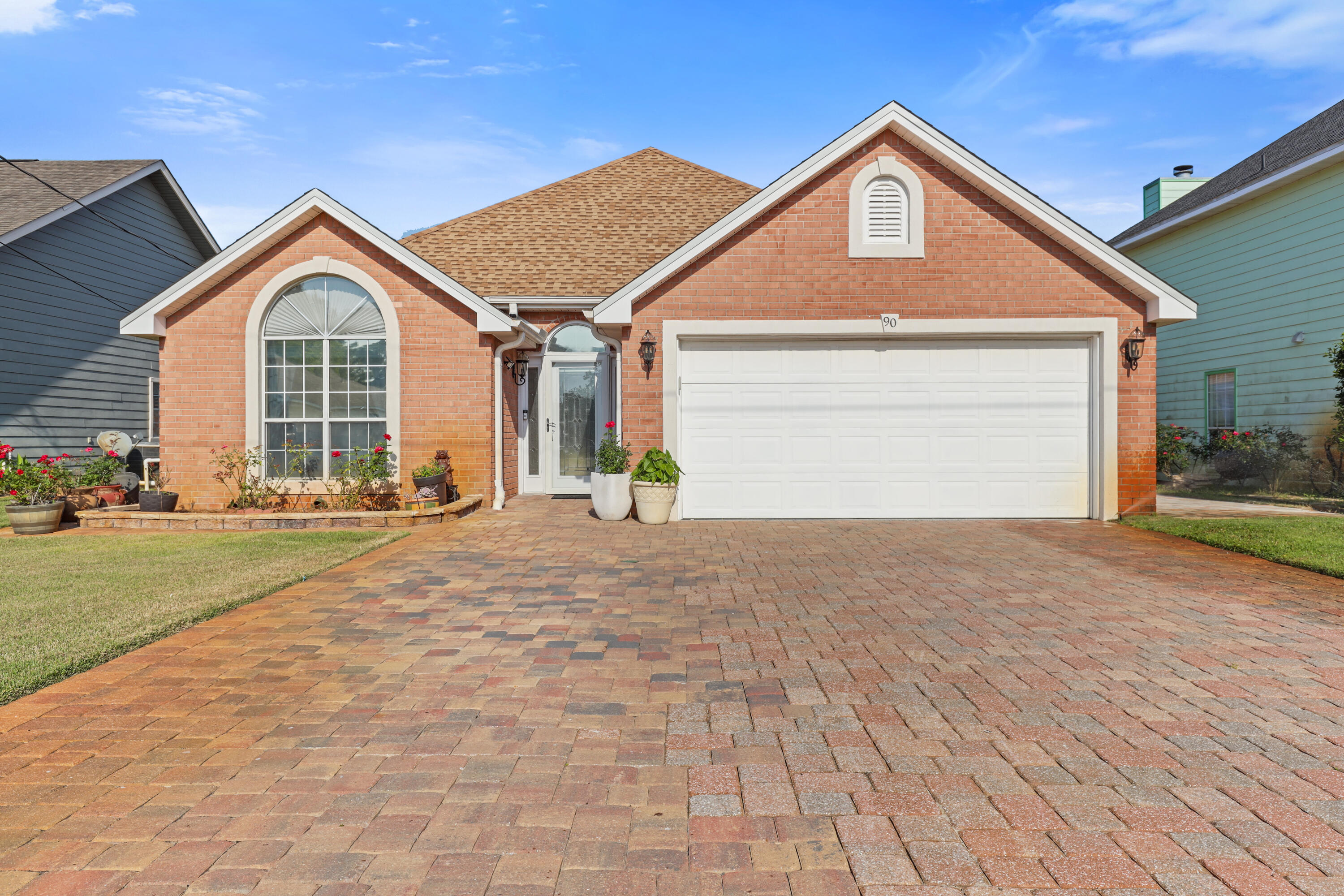 a view of a house with a yard and garage