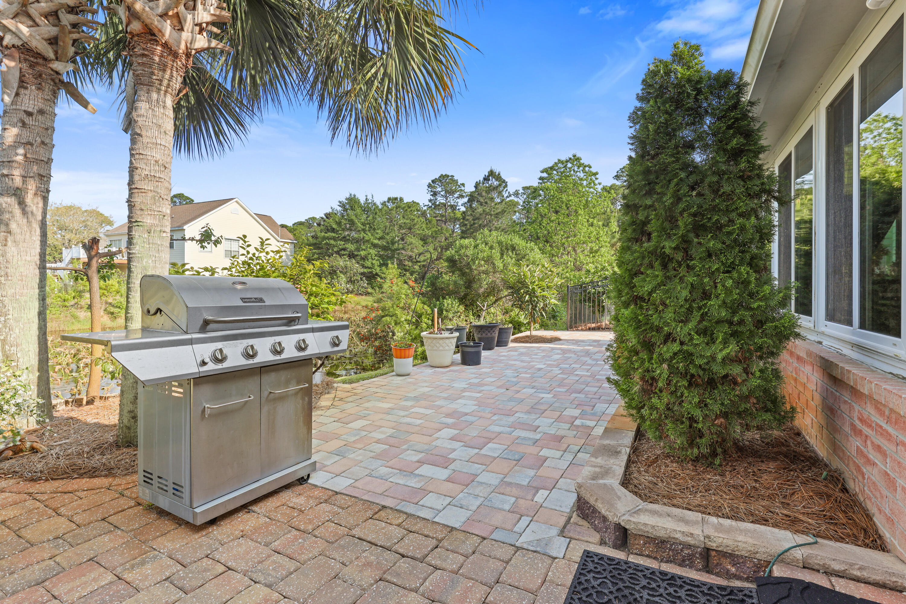 90 Hidden Lakes Drive Miramar Beach, FL 32550 - Photo 15 of 18 a view of a backyard with plants