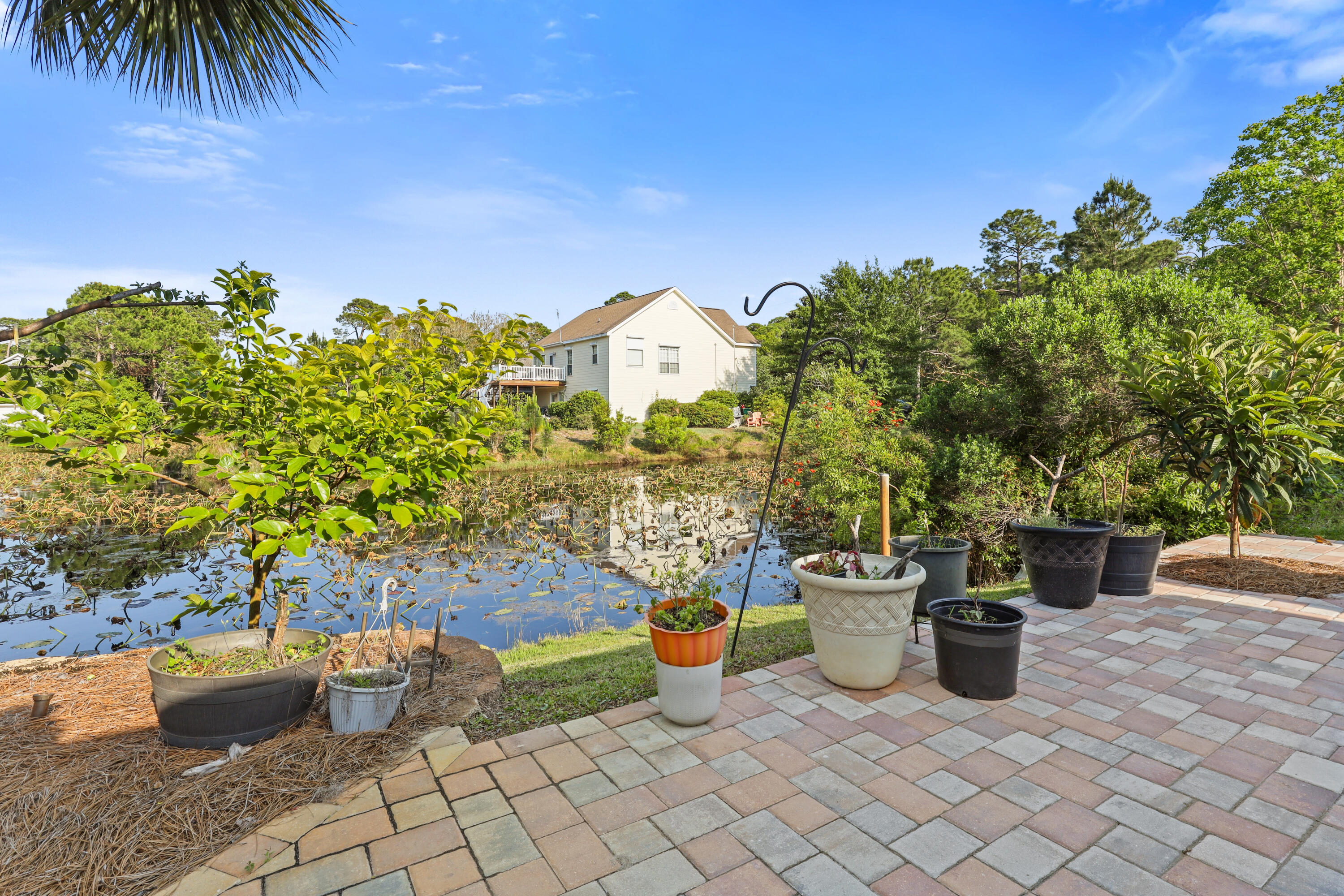90 Hidden Lakes Drive Miramar Beach, FL 32550 - Photo 17 of 18 a view of a terrace with chairs and potted plants