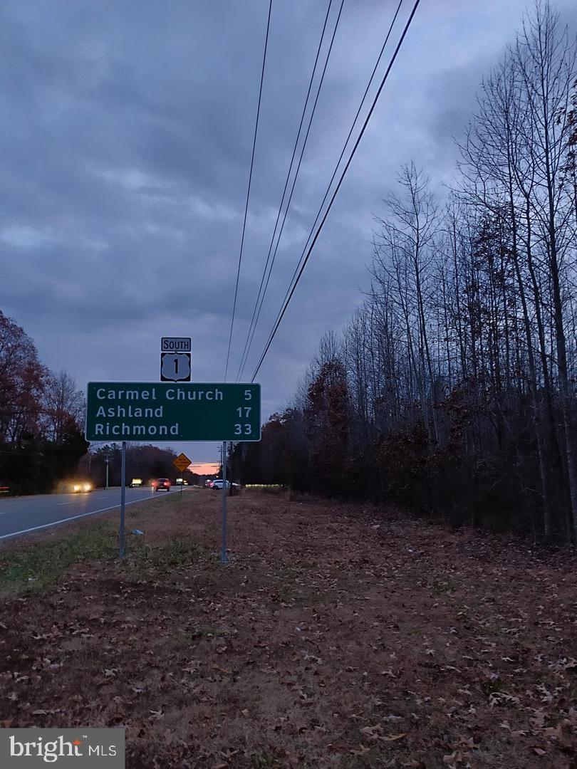 1 Us Route Ruther Glen, VA 22546 - Photo 7 of 8 a view of a backyard with green space