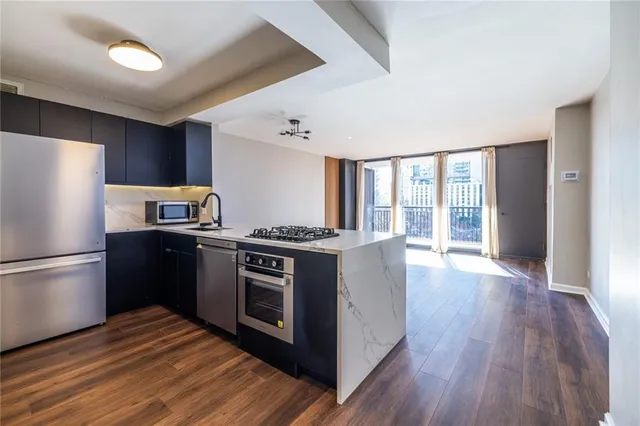 a kitchen with a stove and a refrigerator