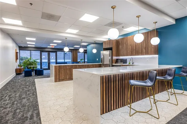 a room with lots of wooden furniture and a projector