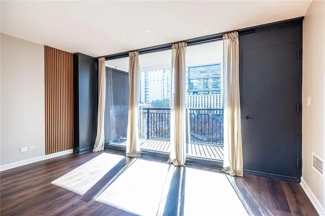 a view of entryway with wooden floor