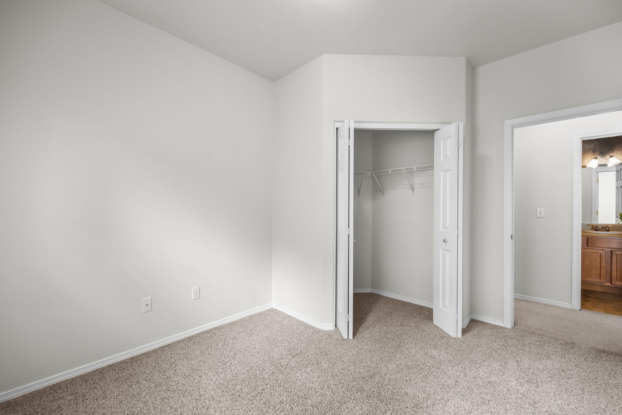 61311 Southwest Brookside Loop Bend, OR 97702 - Photo 24 of 30 Bedroom three is slightly larger than bedroom two and also offers a walk-in closet.