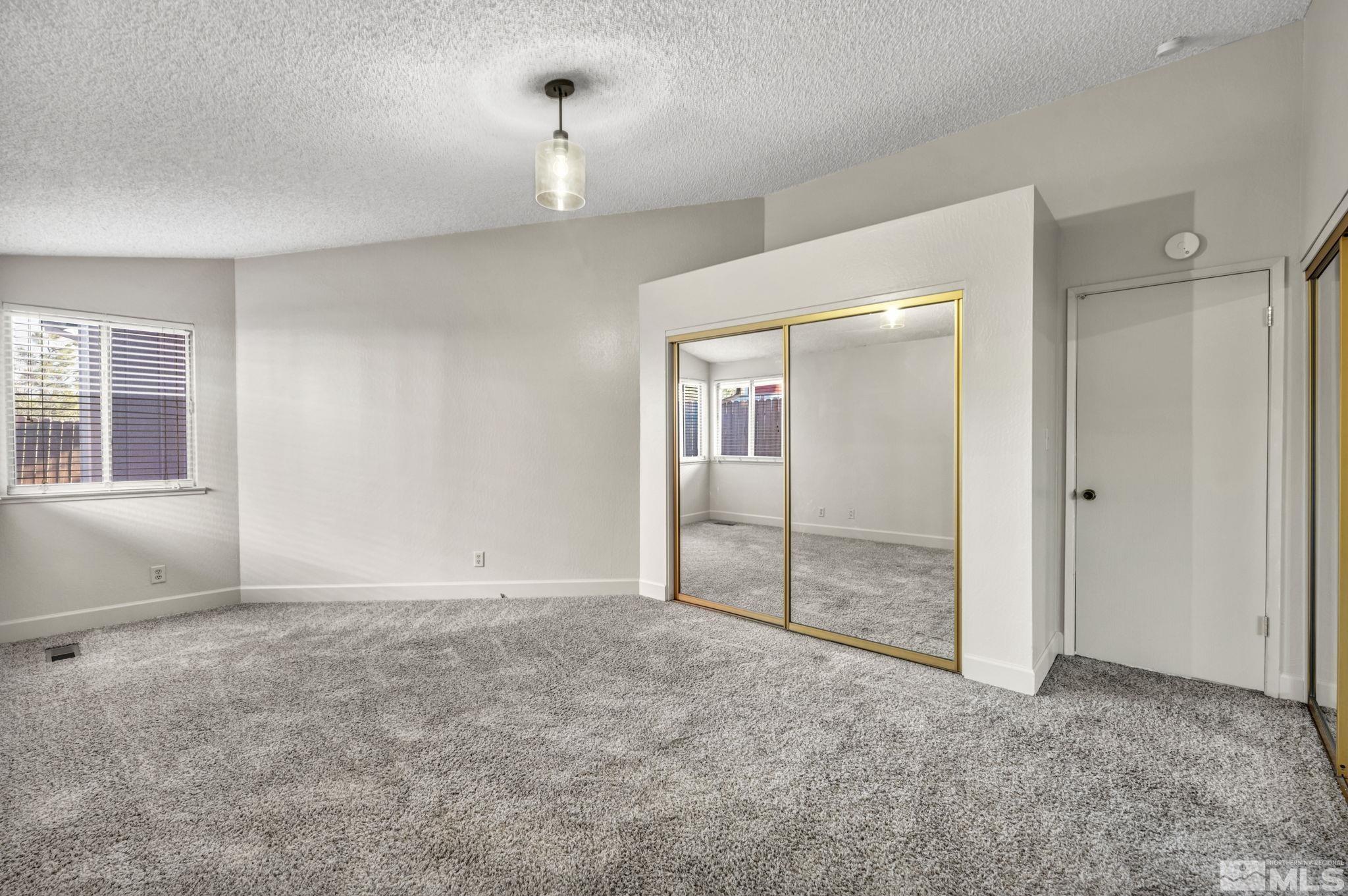 1300 Canyon Creek Road Reno, NV 89523 - Photo 19 of 29 an empty room with windows and closet