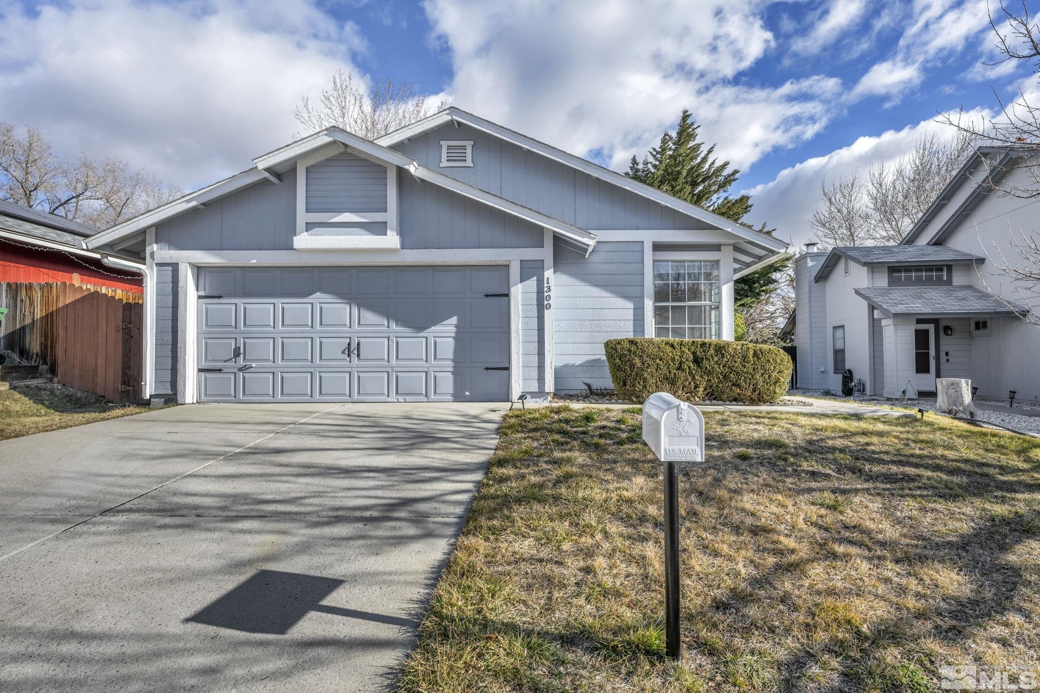 1300 Canyon Creek Road Reno, NV 89523 - Photo 3 of 29 a front view of a house with a yard