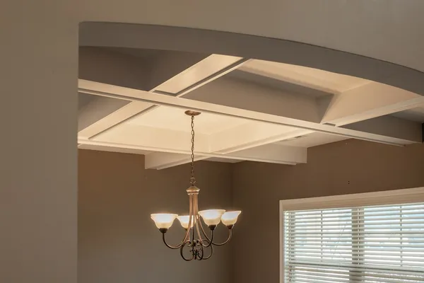 a kitchen with stainless steel appliances granite countertop a stove top oven a sink dishwasher a dining table and chairs