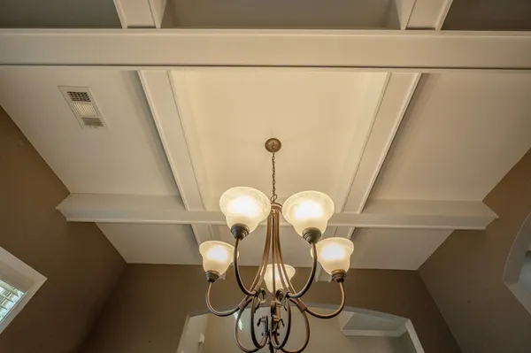 a kitchen with a sink a counter space appliances and cabinets