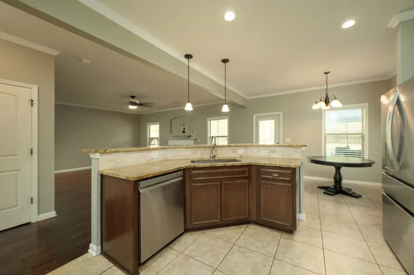 a living room with furniture and a air conditioner vent