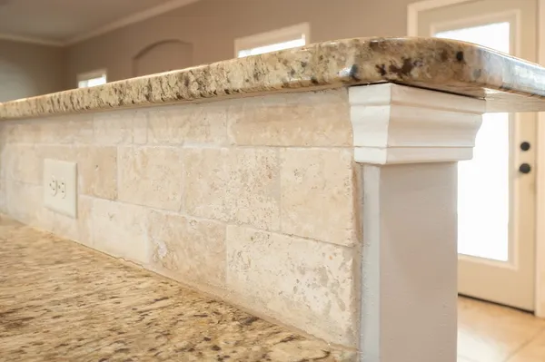 a view of a livingroom with a fireplace a ceiling fan a fireplace and windows