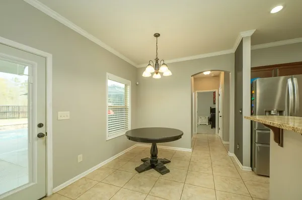 a view of a hallway with windows