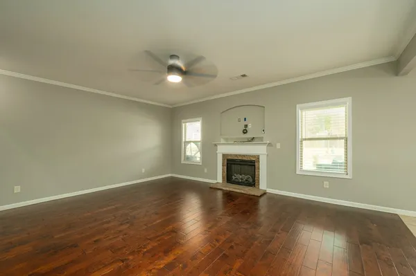 a spacious bathroom with a granite countertop sink mirror and toilet