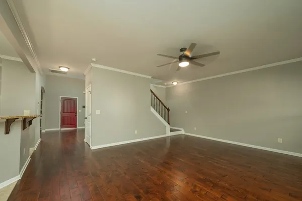 a bathroom with a granite countertop sink a mirror and a shower