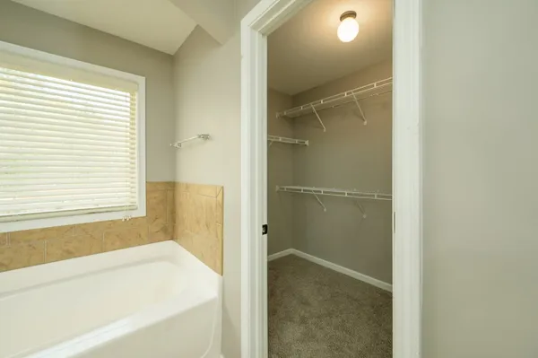 a bathroom with a bathtub and shower