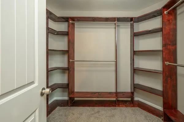 a view of a house with swimming pool and sitting area