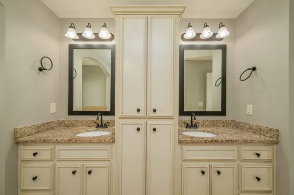 a view of a room with wooden floor and iron stairs