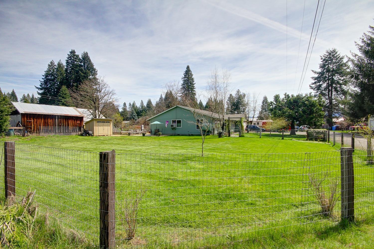 407 Shady Lane Prospect, OR 97536 - Photo 2 of 35 Fully fenced, lush yard