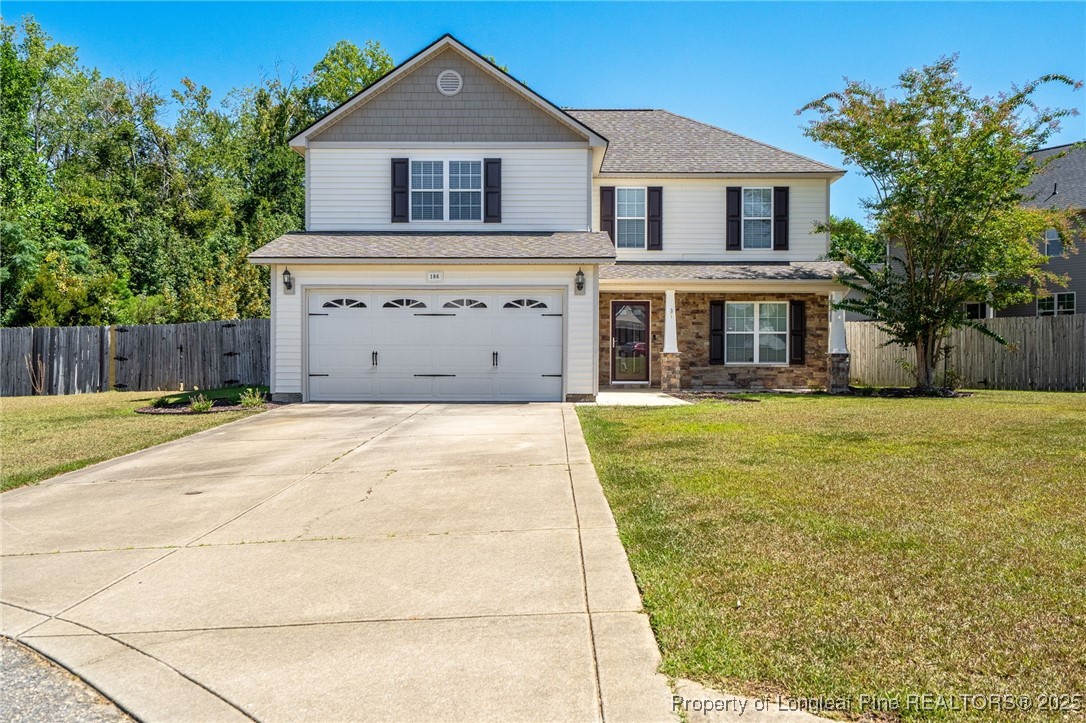 a view of house with yard