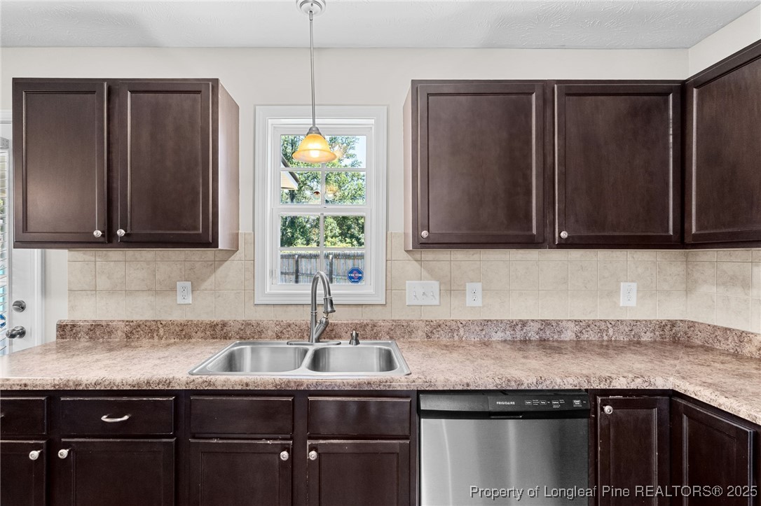186 Scanner Court Raeford, NC 28376 - Photo 12 of 49 a kitchen with granite countertop a sink and a stove