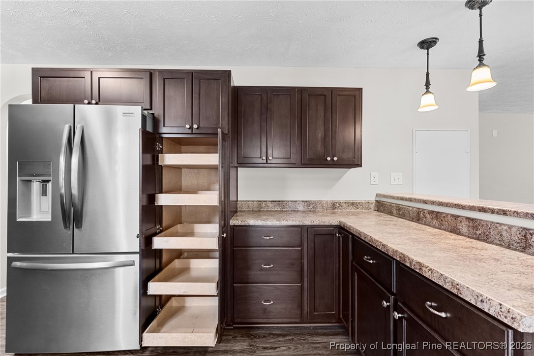 186 Scanner Court Raeford, NC 28376 - Photo 14 of 49 a kitchen with granite countertop a refrigerator and a sink