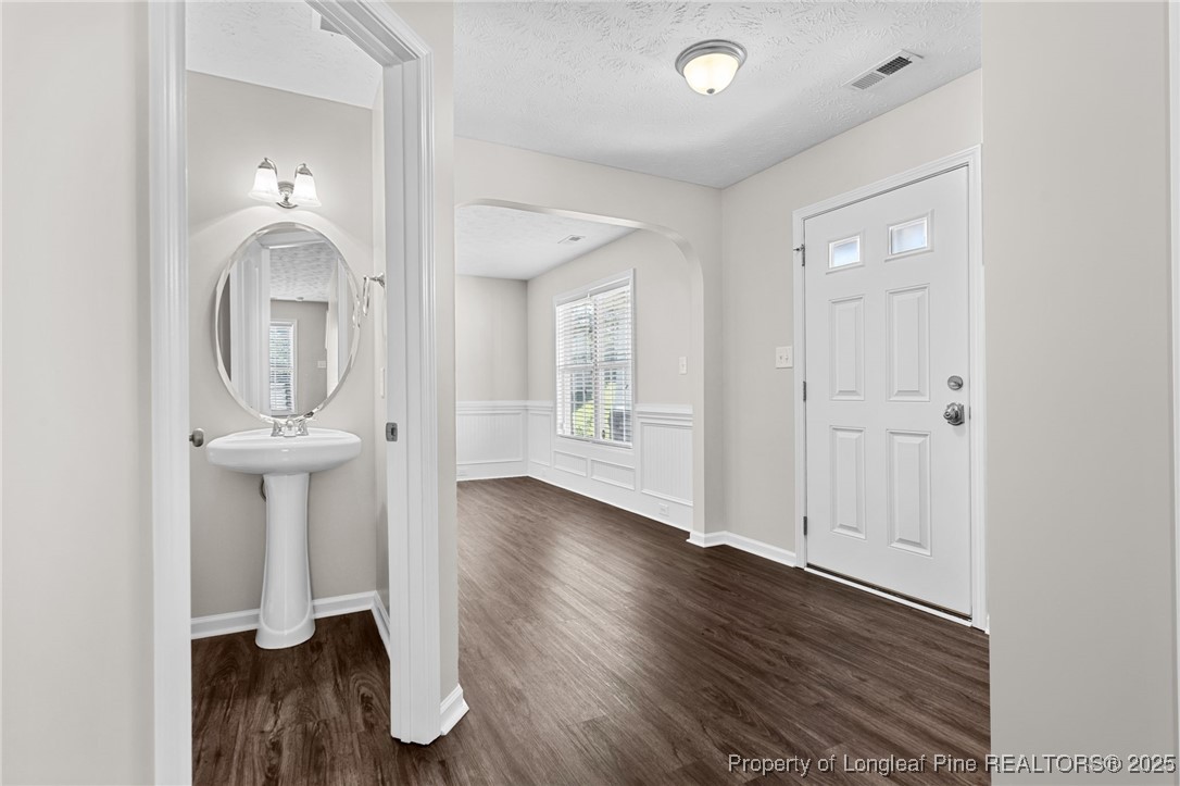186 Scanner Court Raeford, NC 28376 - Photo 18 of 49 wooden floor in an empty room with a window
