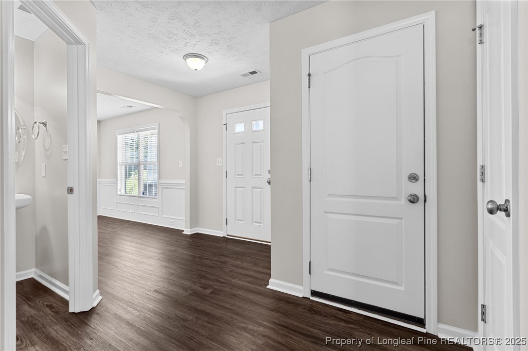186 Scanner Court Raeford, NC 28376 - Photo 19 of 49 a view of an empty room with wooden floor