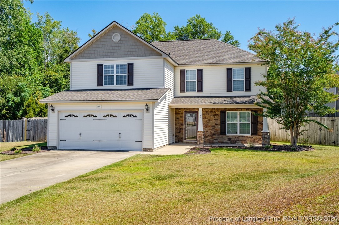 186 Scanner Court Raeford, NC 28376 - Photo 2 of 49 a front view of a house with a yard