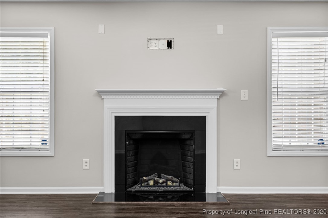 186 Scanner Court Raeford, NC 28376 - Photo 22 of 49 a living room with a fireplace and a fireplace