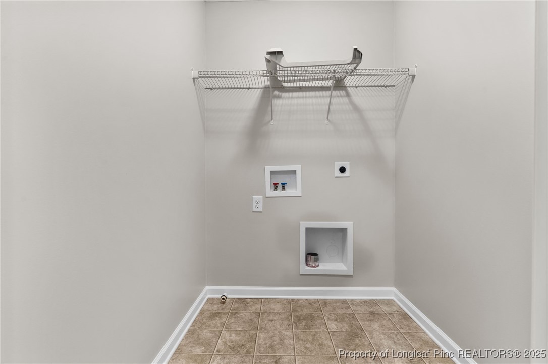 186 Scanner Court Raeford, NC 28376 - Photo 27 of 49 a view of a closet area with wooden floor