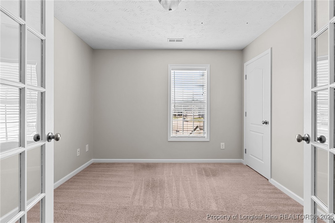186 Scanner Court Raeford, NC 28376 - Photo 30 of 49 a view of an empty room with a window