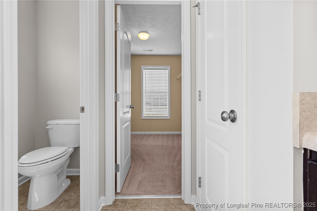186 Scanner Court Raeford, NC 28376 - Photo 35 of 49 a bathroom with a toilet