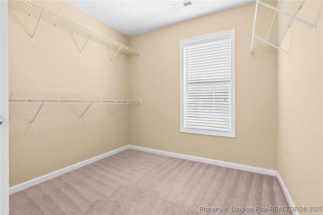 186 Scanner Court Raeford, NC 28376 - Photo 36 of 49 a view of a room that has a window and cabinets