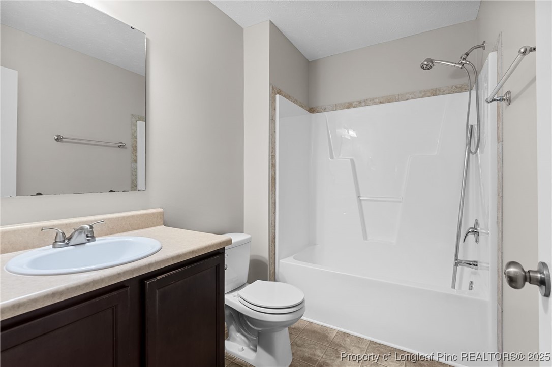 186 Scanner Court Raeford, NC 28376 - Photo 39 of 49 a bathroom with a sink toilet and shower