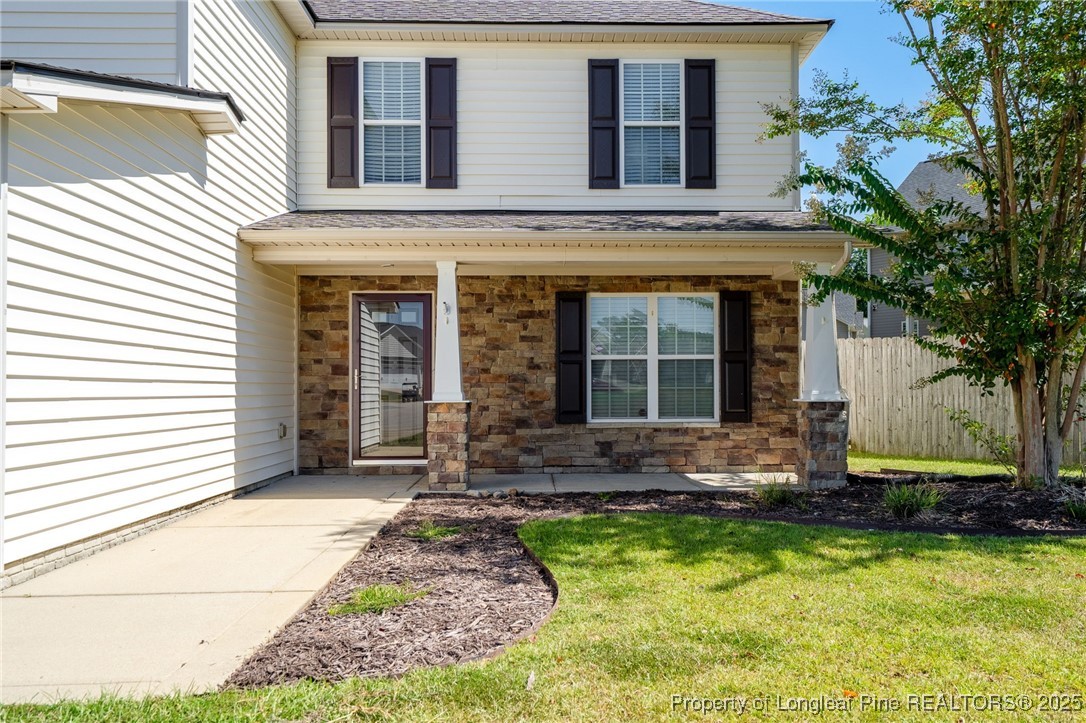 186 Scanner Court Raeford, NC 28376 - Photo 4 of 49 a front view of a house with yard and seating space