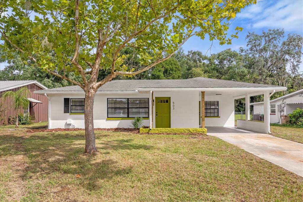 503 Ohio Boulevard Eustis, FL 32726 - Photo 1 of 1 front view of a house with a big yard and large trees
