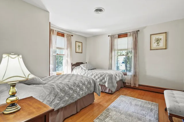a bedroom with bed and window